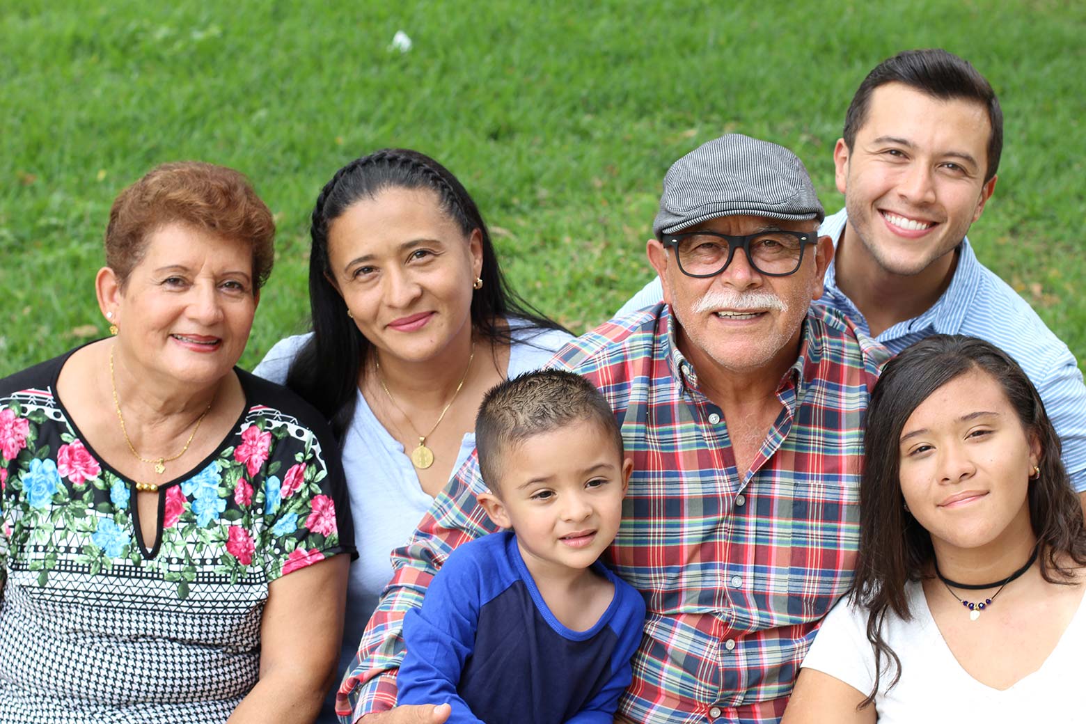 Latino extended family smiling.