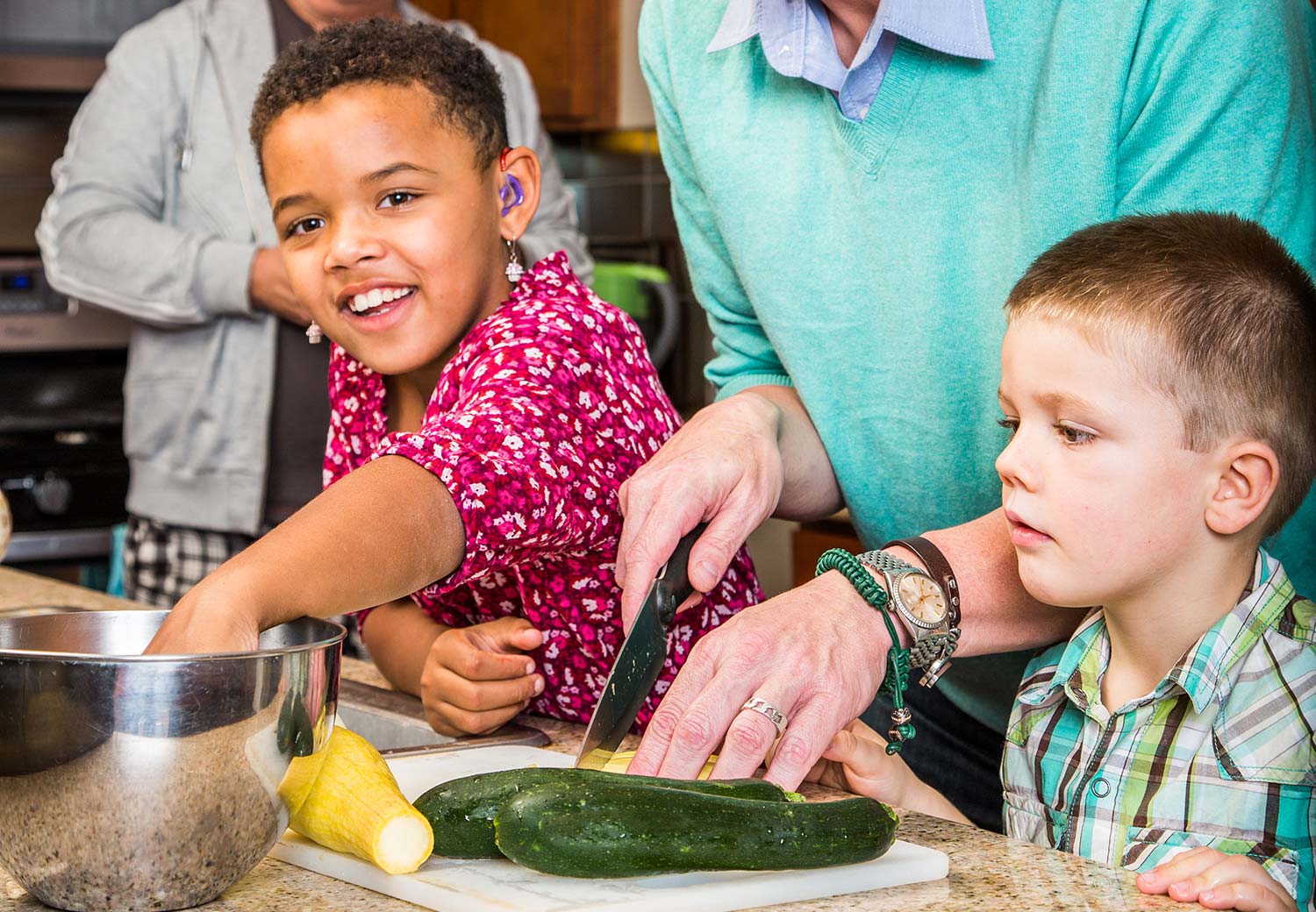 Children helping cook healthy foods
